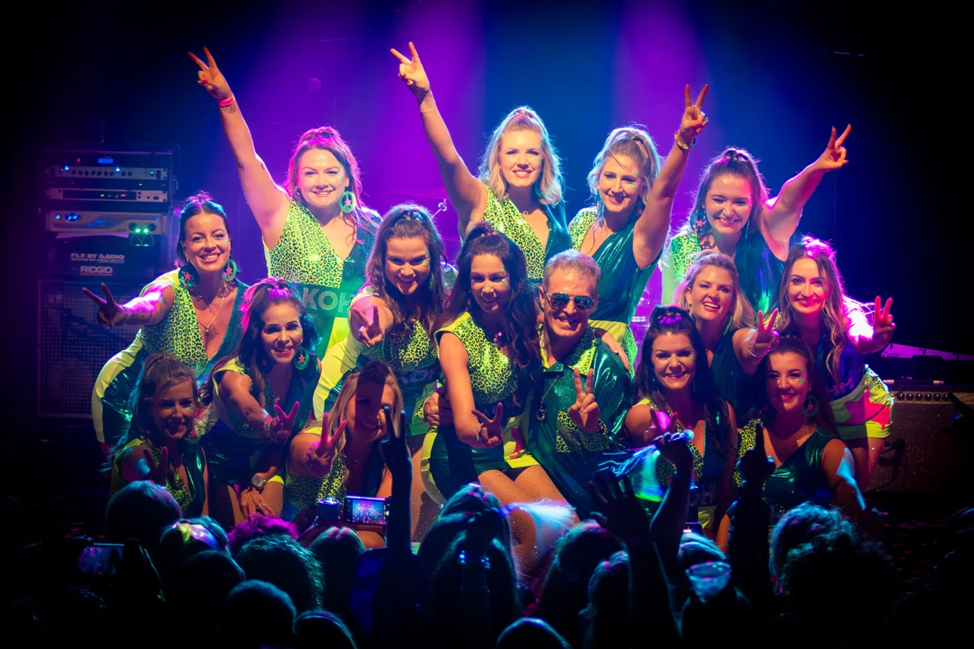 Hip Huggers members celebrate together on stage at their 2026 ball