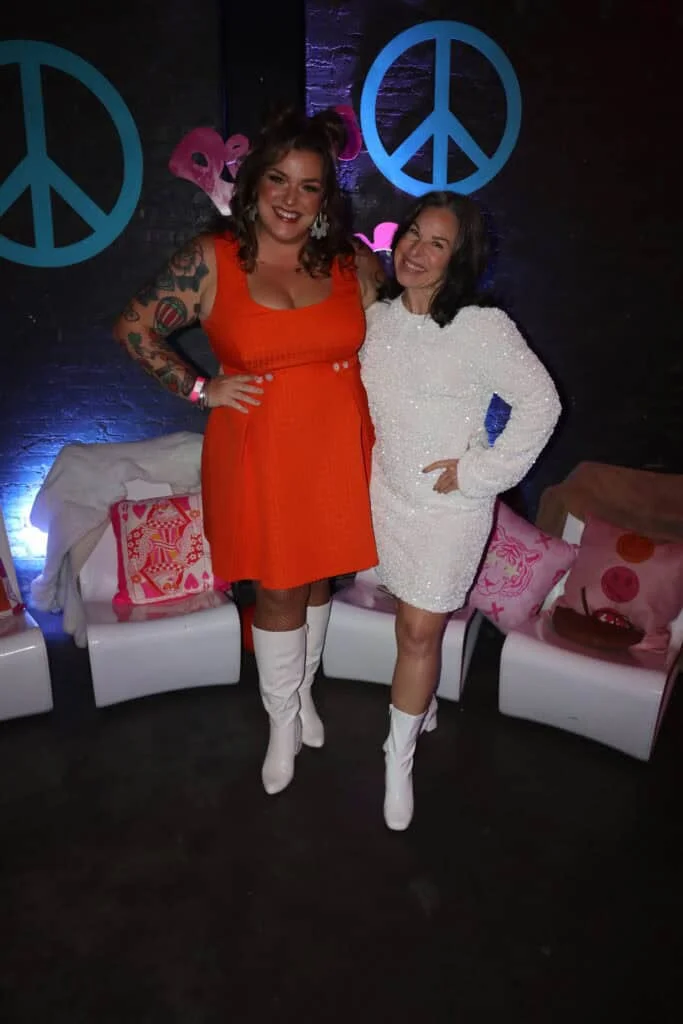 Jillian Holt and Tiffany Sanders in go-go boots at the 2026 ball